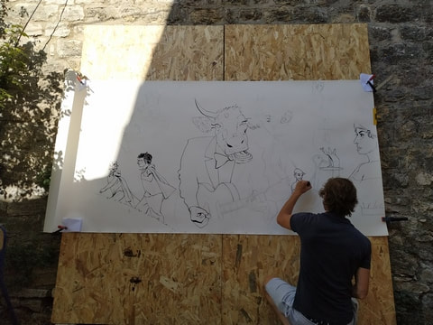 Un dessinateur au travail
